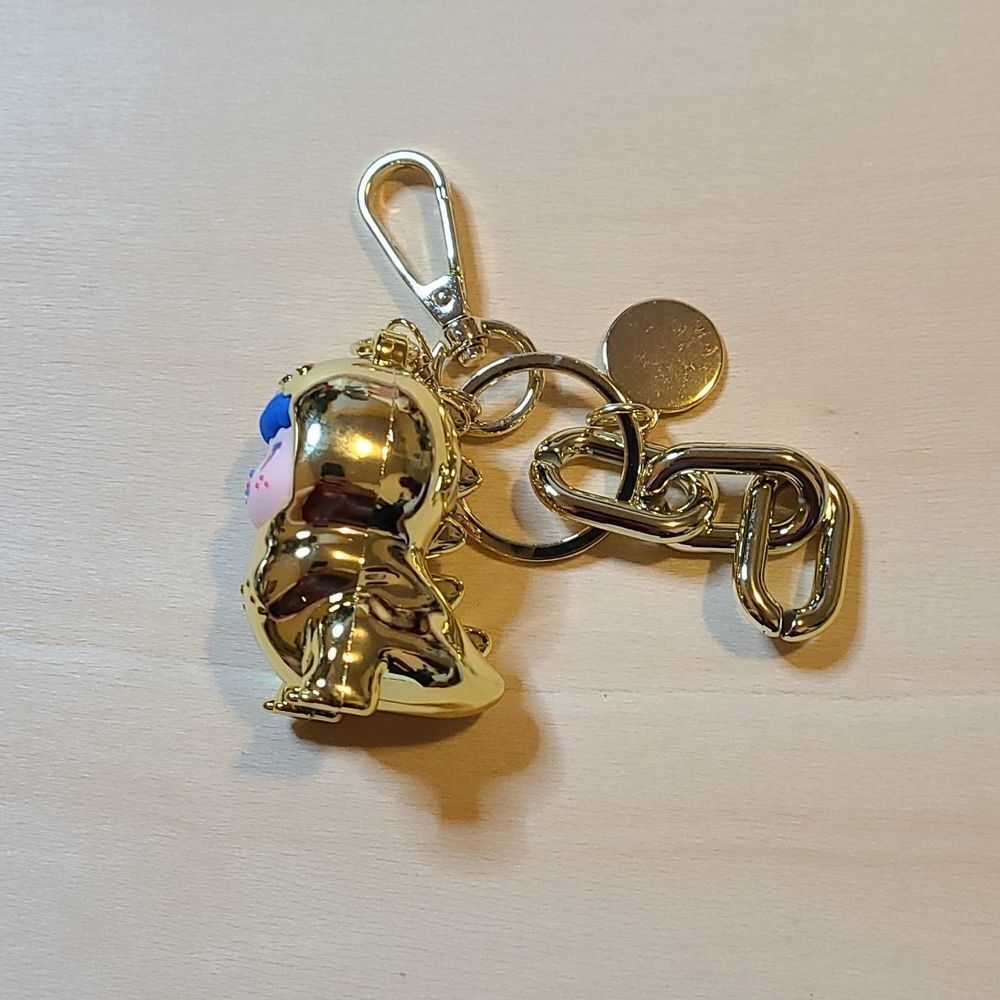 Tyrannosaurus gold pendant keychain